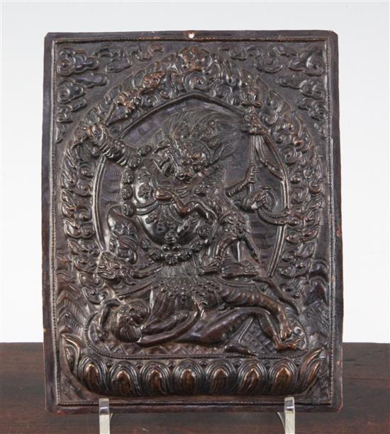 A Tibetan copper plaque of Mahakala and consort, 19th / 20th century, 19.5cm